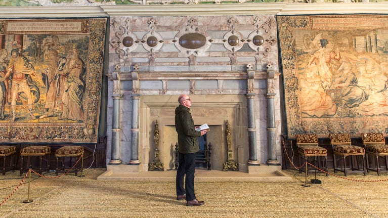 Visitors exploring the Long Gallery at Hardwick, Derbyshire